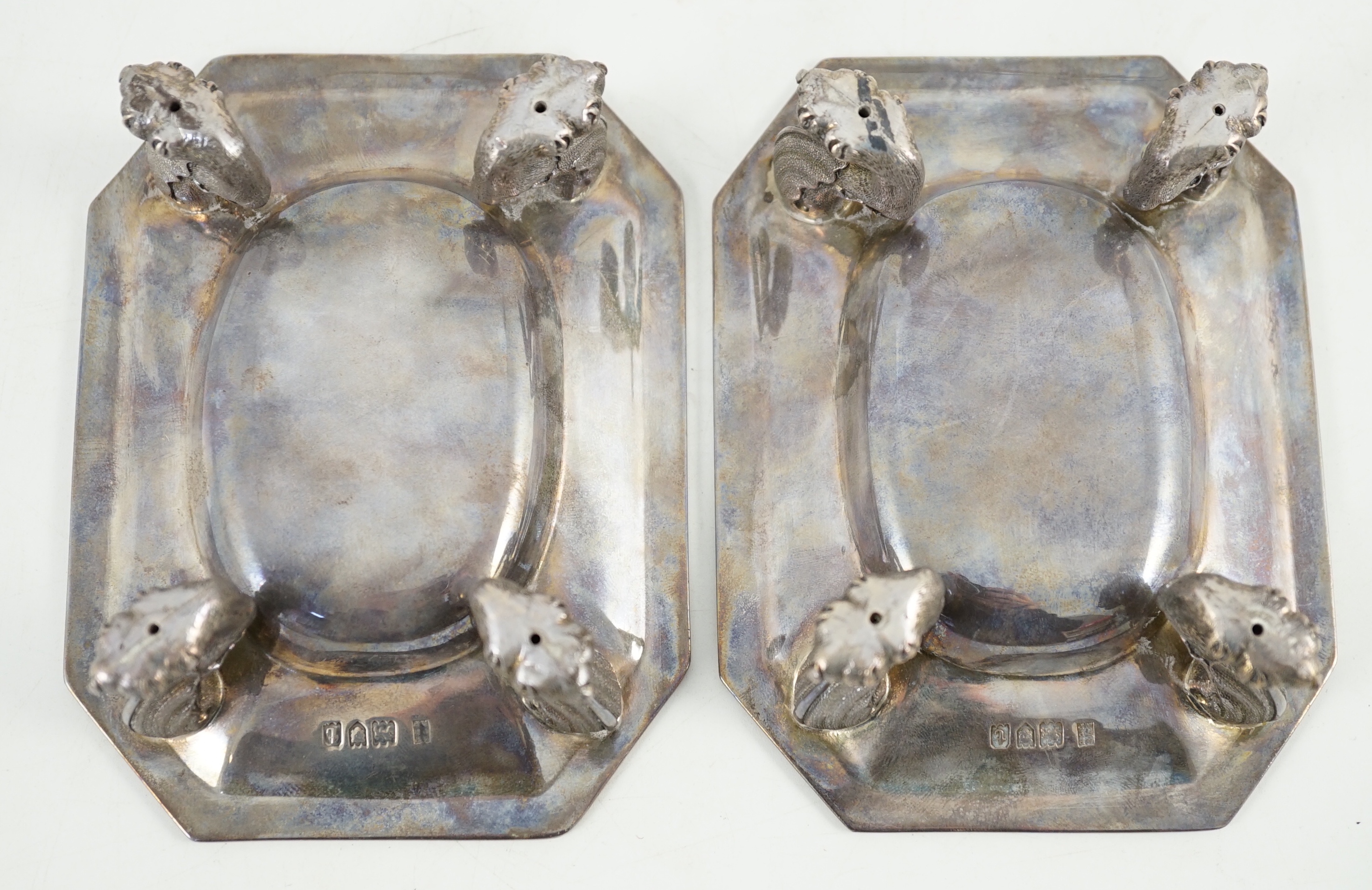 A pair of George V silver salt cellars, with cut glass liners